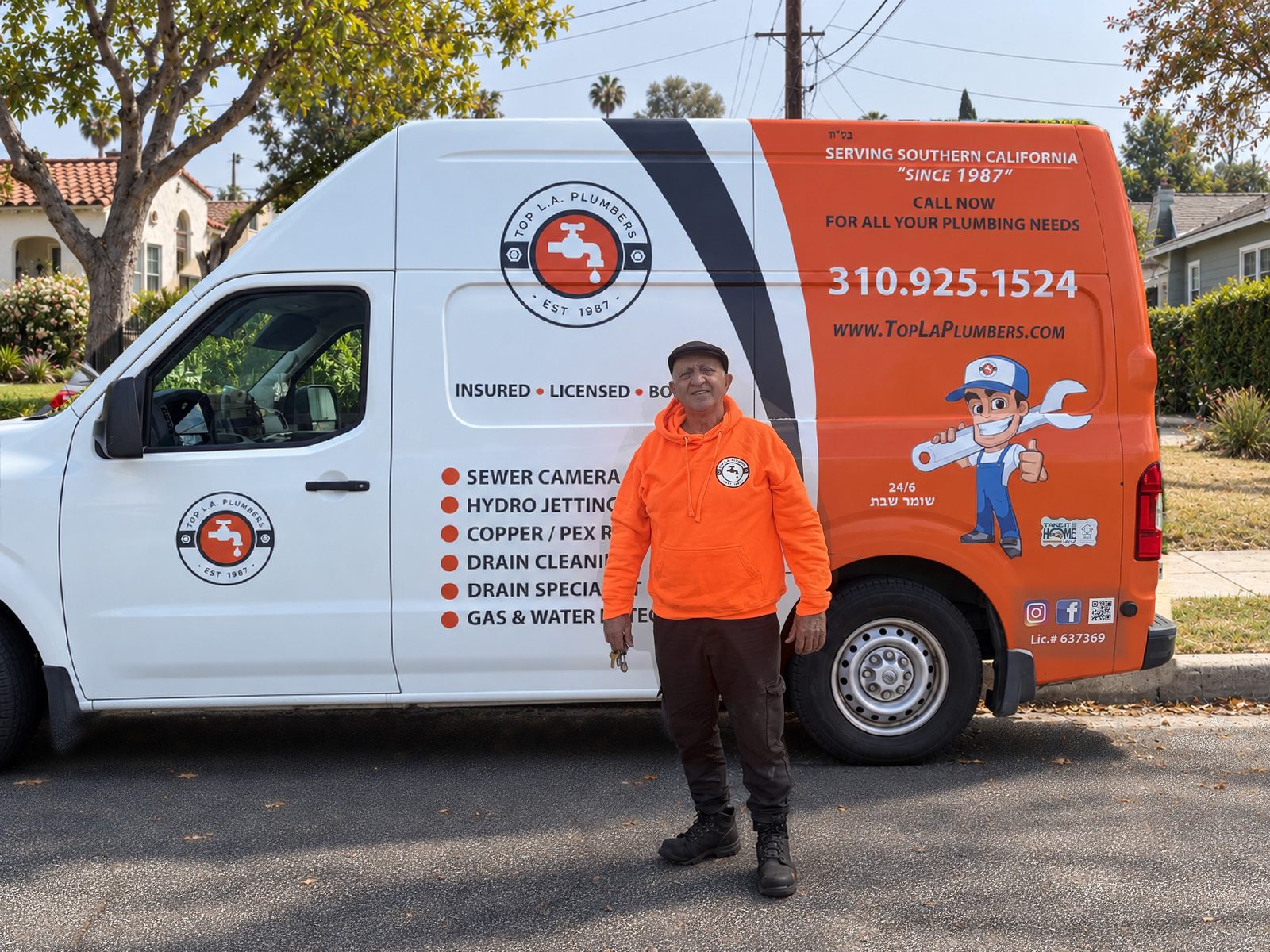 Arie standing in front of his Top LA Plumbers van